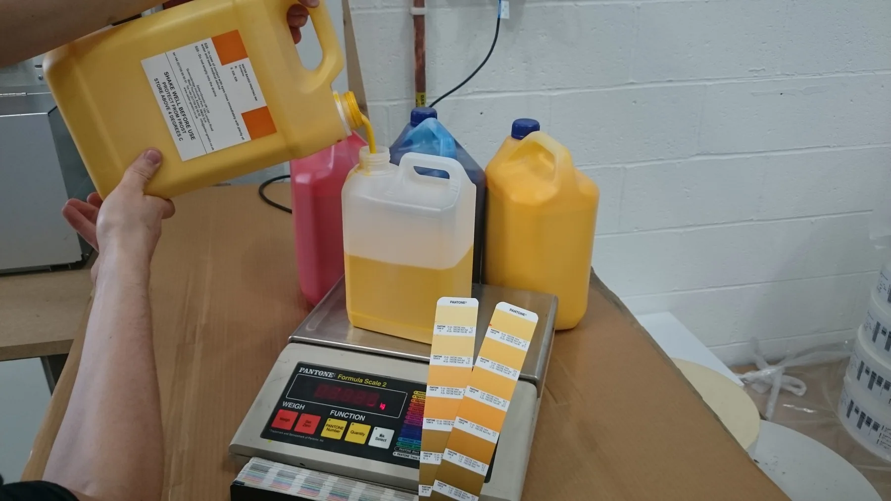 Ink colours being prepared and mixed for printing